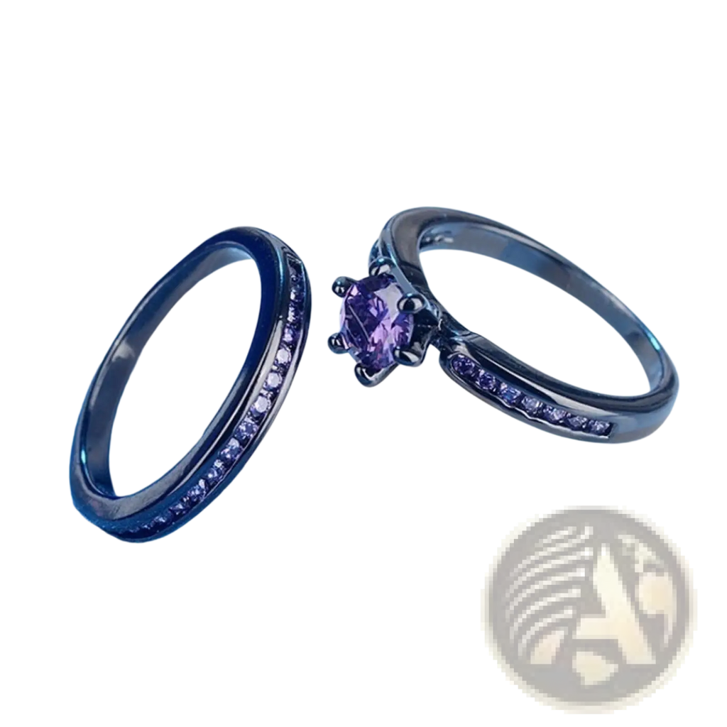 A black tungsten wedding band set featuring a ring with a central purple gemstone and another with multiple purple gems