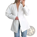 White blazer with oversized sleeves and deep v-neckline made of smooth fabric, styled as a black v-neck commute jacket