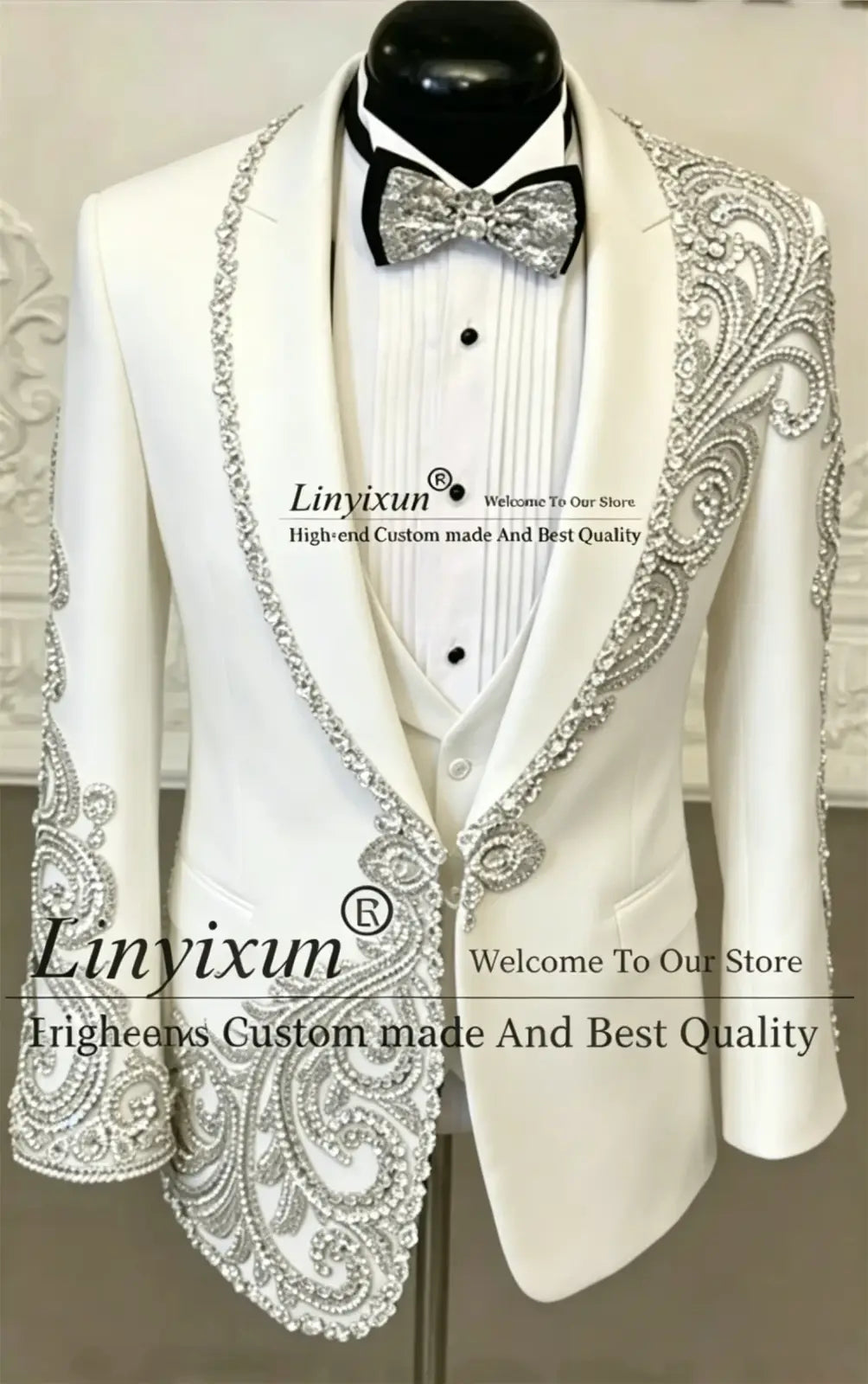 White tuxedo jacket with intricate silver beaded embroidery on lapels shoulders and cuffs for men wedding tuxedo suit