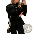 Black quilted mini handbag with gold chain strap complementing a black velvet gold button blazer