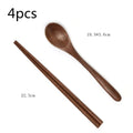 Set of four handcrafted black walnut wood chopsticks and a smooth dark brown wooden dining spoon with natural grain patterns