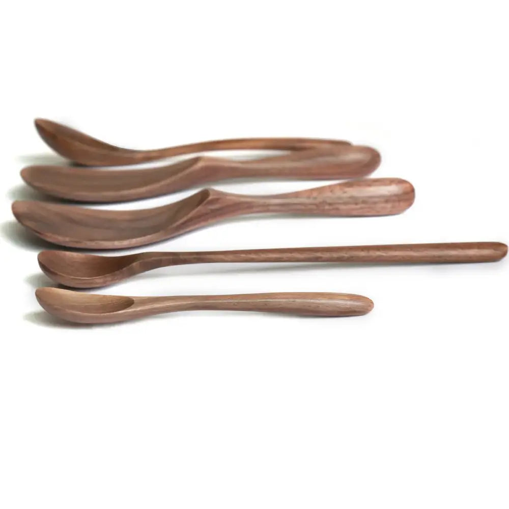 Set of six handcrafted black walnut wood dining spoons with smooth natural finish in varying sizes
