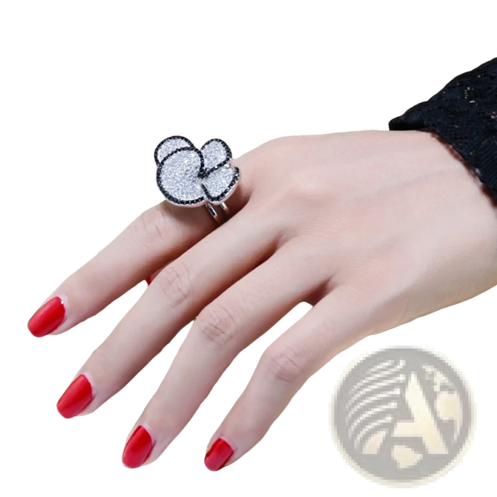 Black and white crystal statement flower ring featuring a sparkling silver cloud shape with black outline and pave stones