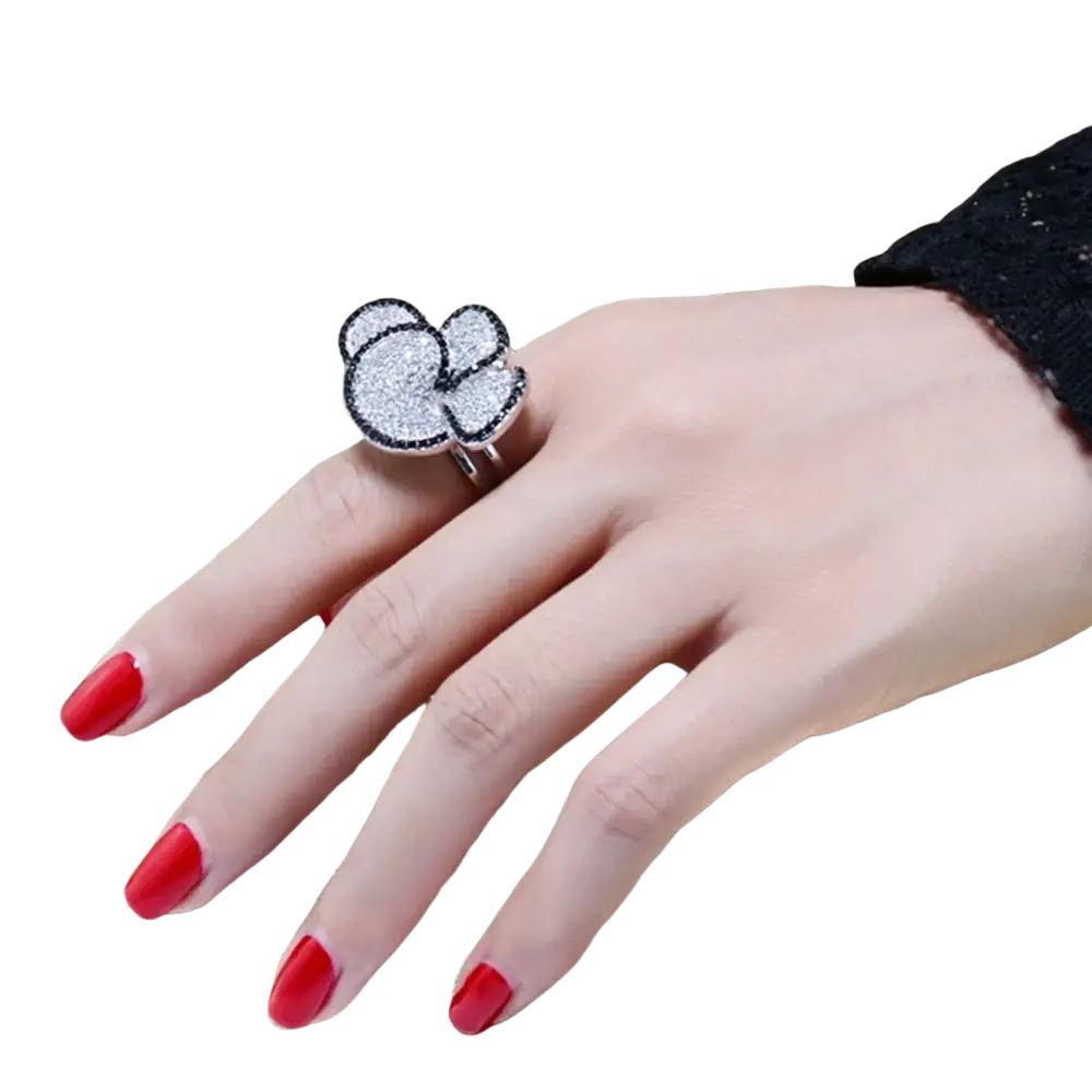 Black and white crystal statement flower ring featuring a sparkling silver cloud shape with black outline and pave stones