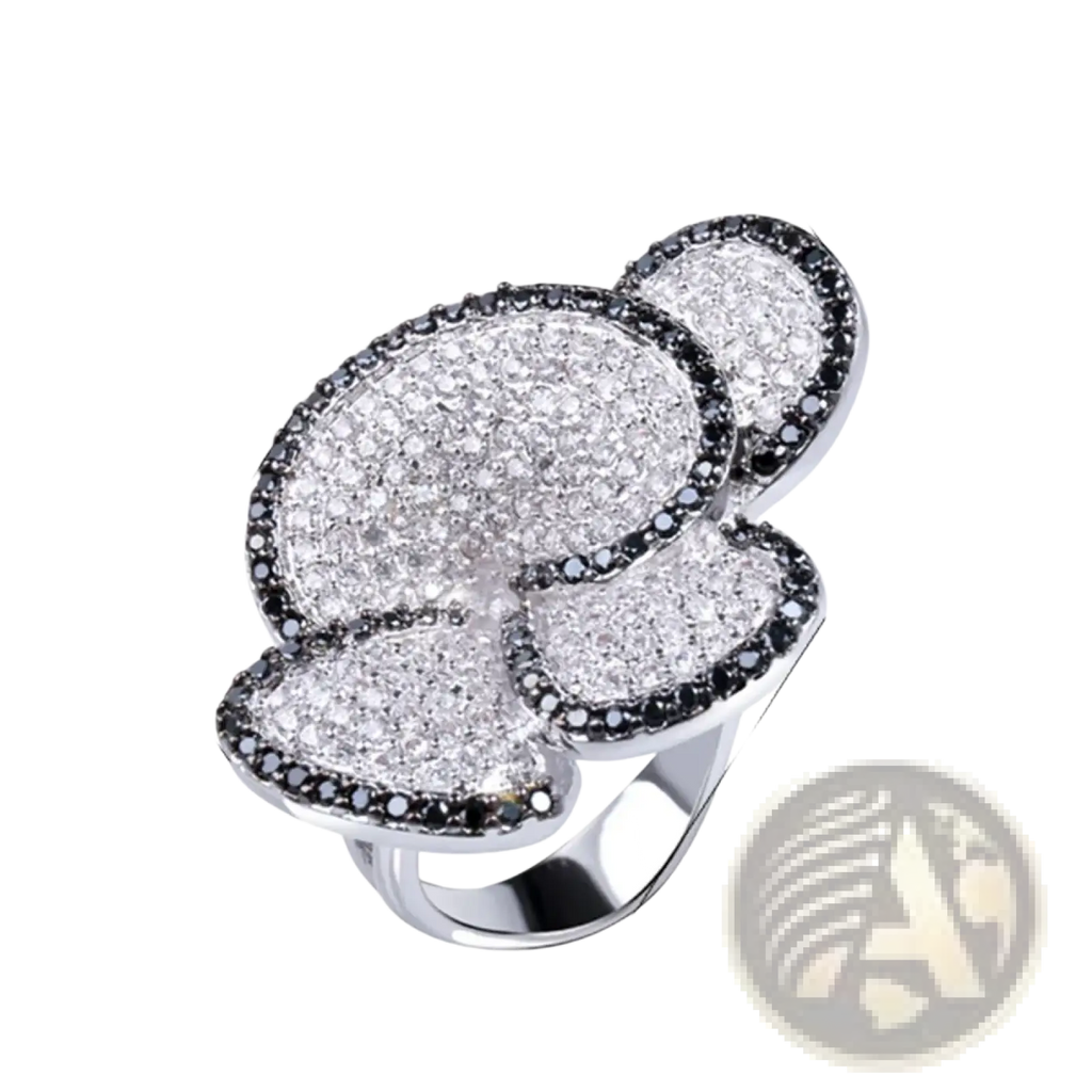 A sparkling silver black and white crystal statement flower ring with a large three-petal design and pavé diamonds