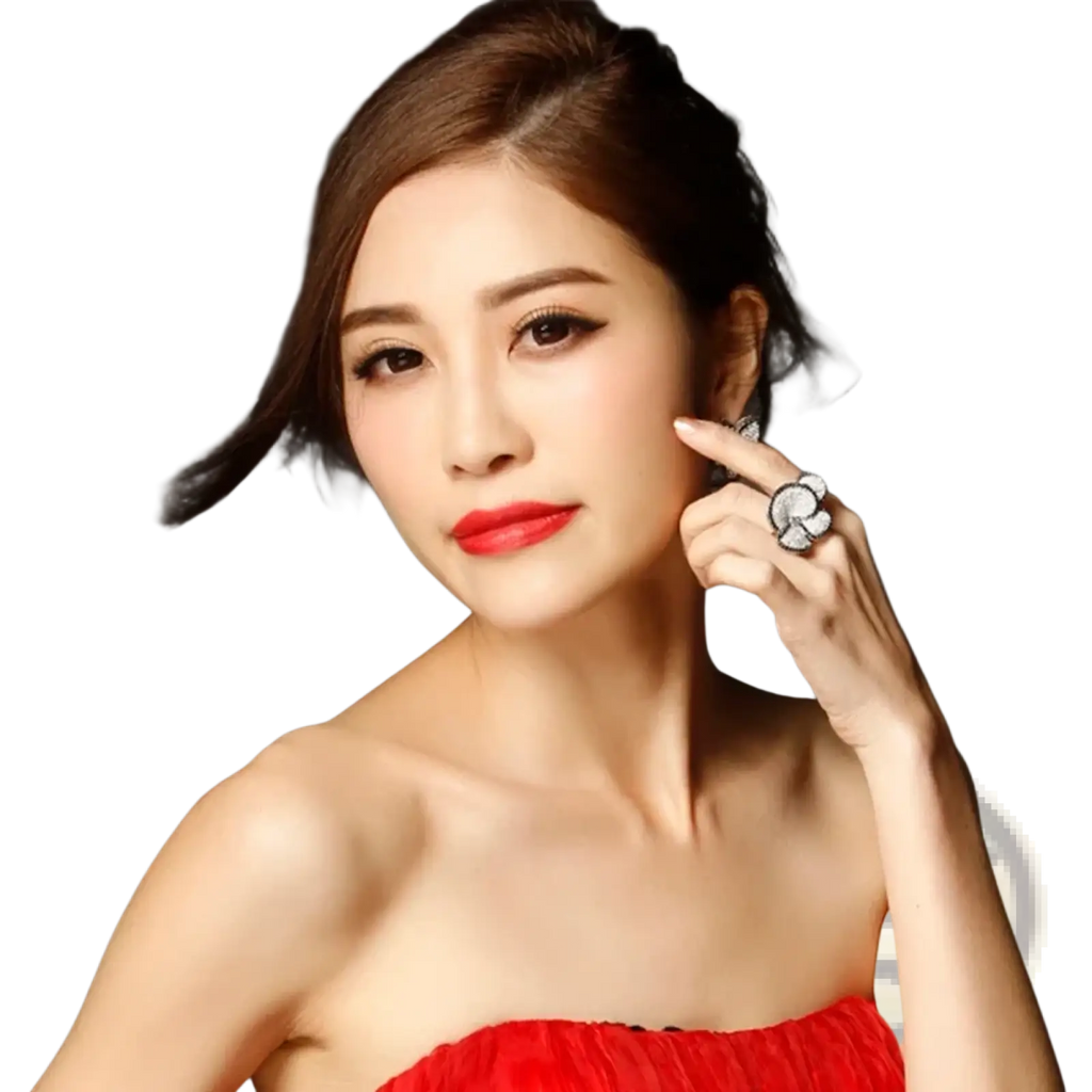 A woman wearing a vibrant red strapless dress with ruched detailing showcasing a black and white crystal statement flower ring