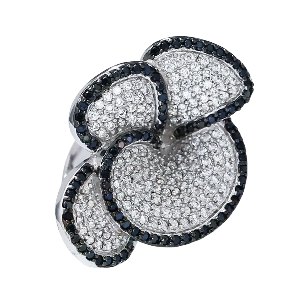Black and white crystal statement flower ring with bold multi-layered pavé white and black diamonds on silver metal