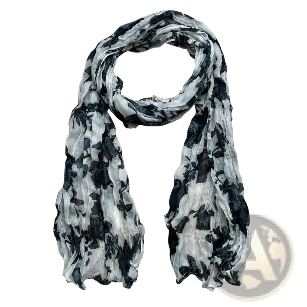 A lightweight sheer black and white floral crinkle chiffon scarf with a flowing pattern for elegant styling
