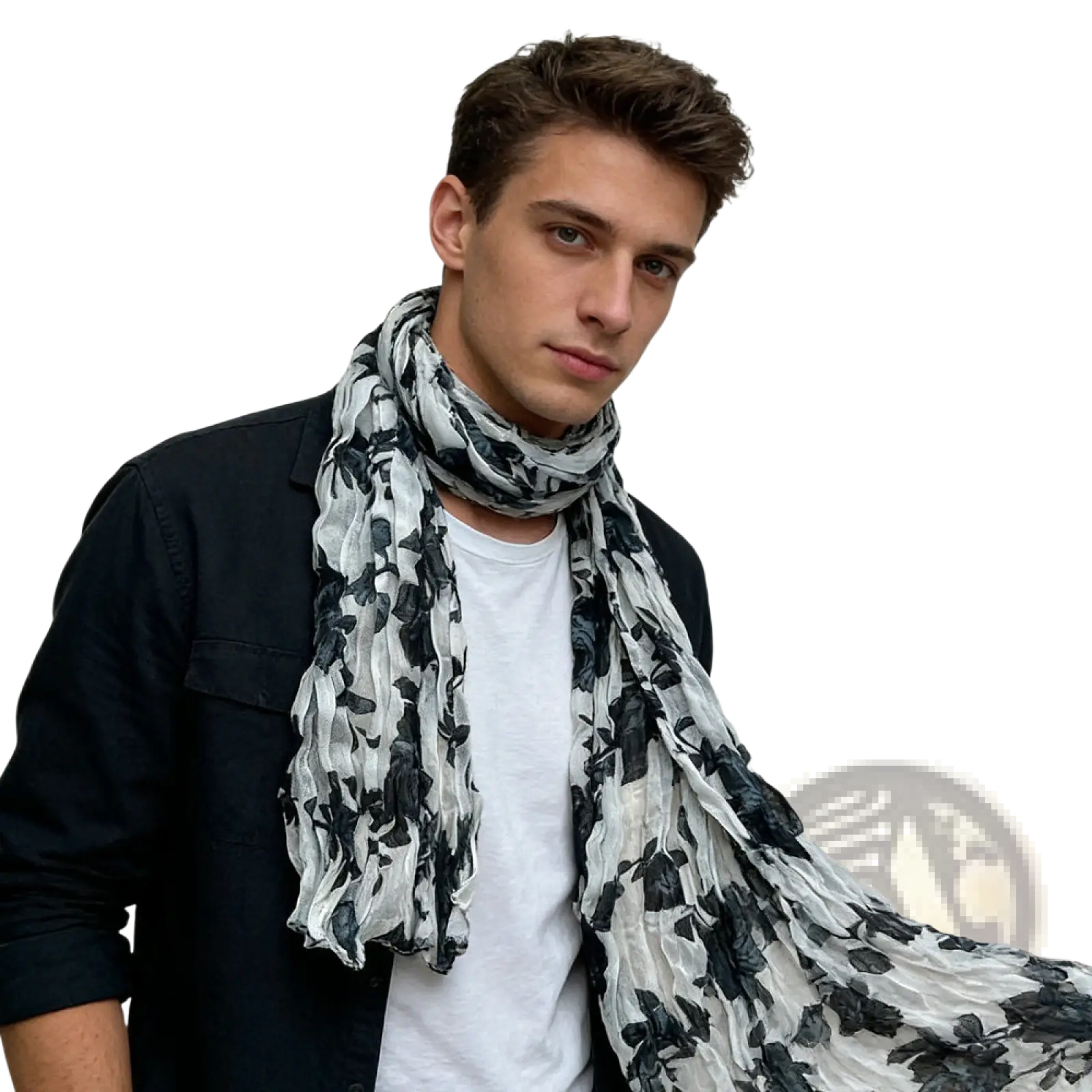 A lightweight black and white floral crinkle chiffon scarf draped around the neck showing its flowing texture