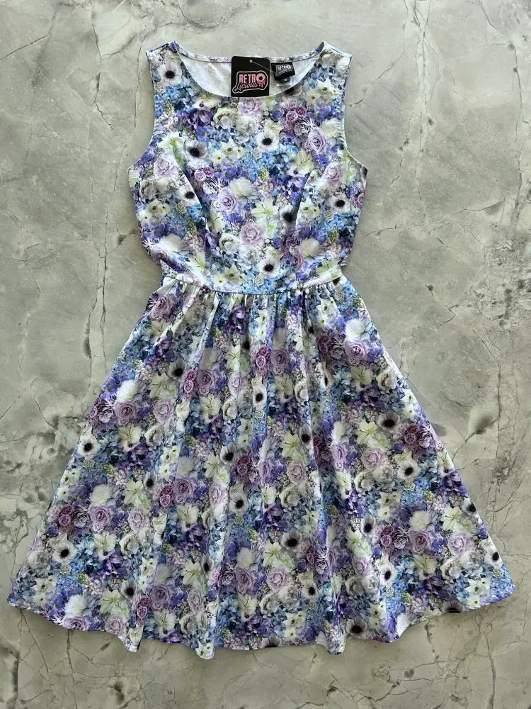 Blossom Vintage 1950s floral cotton midi dress with pockets featuring a sleeveless floral print in lavender purple and blue hues