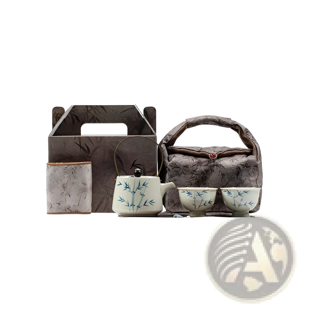 Blue bamboo ceramic teapot set with two cups featuring a white glazed teapot with blue bamboo leaf patterns and black knob