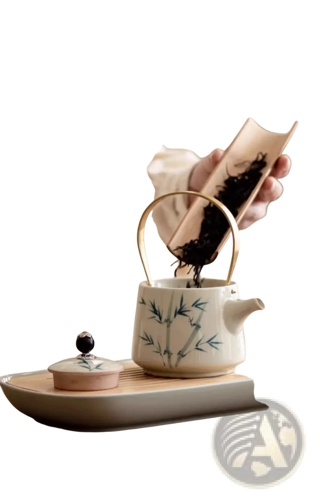 A white ceramic blue bamboo teapot with gold handle resting on a wooden tray in a ceramic teapot set with two cups