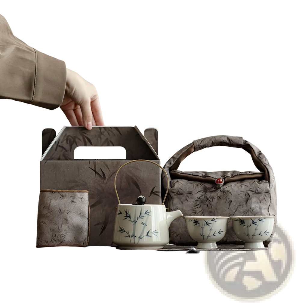 White ceramic teapot with blue bamboo leaf design and gold-toned handle from blue bamboo ceramic teapot set with two cups