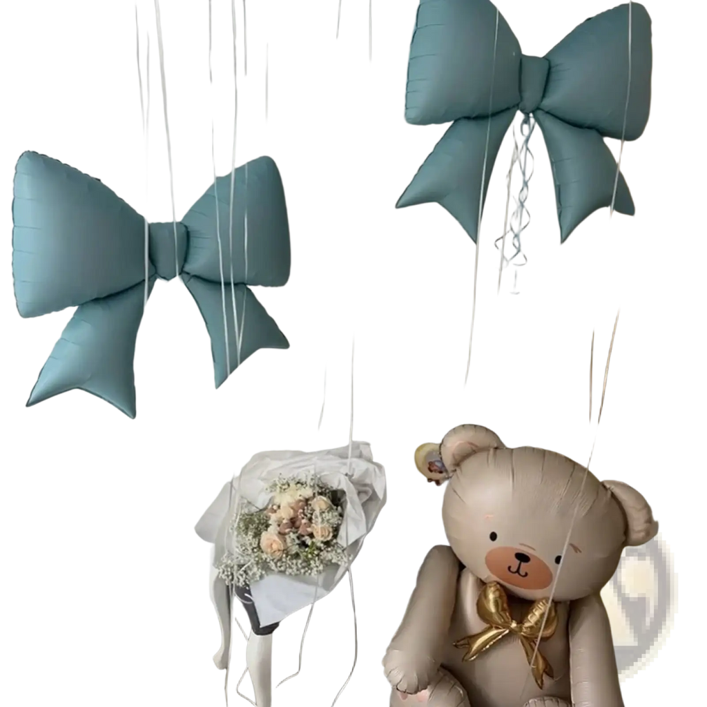 A plush beige teddy bear balloon with a shiny gold bow from the blue bear and bow balloon party set