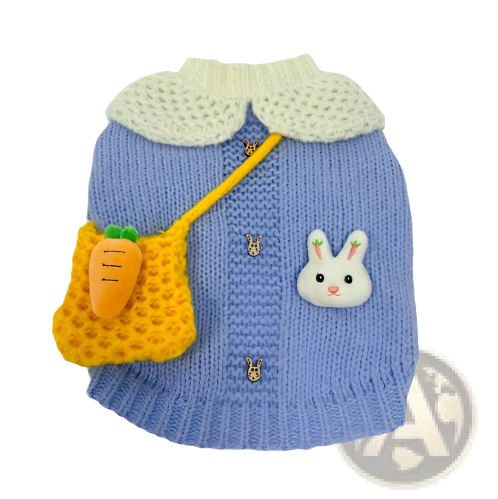 Blue bunny knitted pet sweater in light blue wool with a cream crocheted collar and rabbit-themed decorative pins