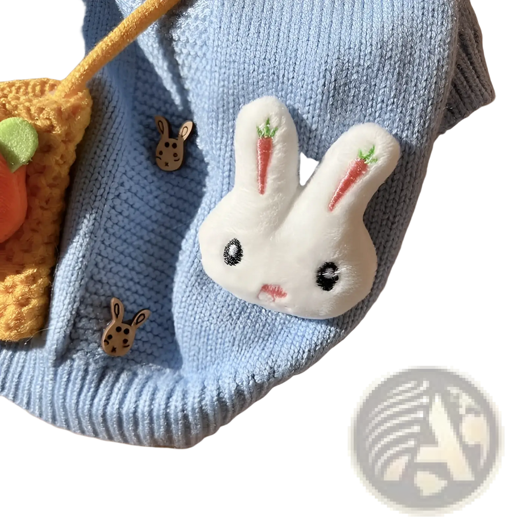 Blue bunny knitted pet sweater featuring a soft white plush rabbit patch with embroidered eyes and red carrots on ears