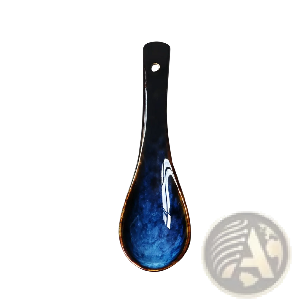 A sleek glossy blue ceramic spoon rest with white swirls and a black handle designed for porcelain tableware use