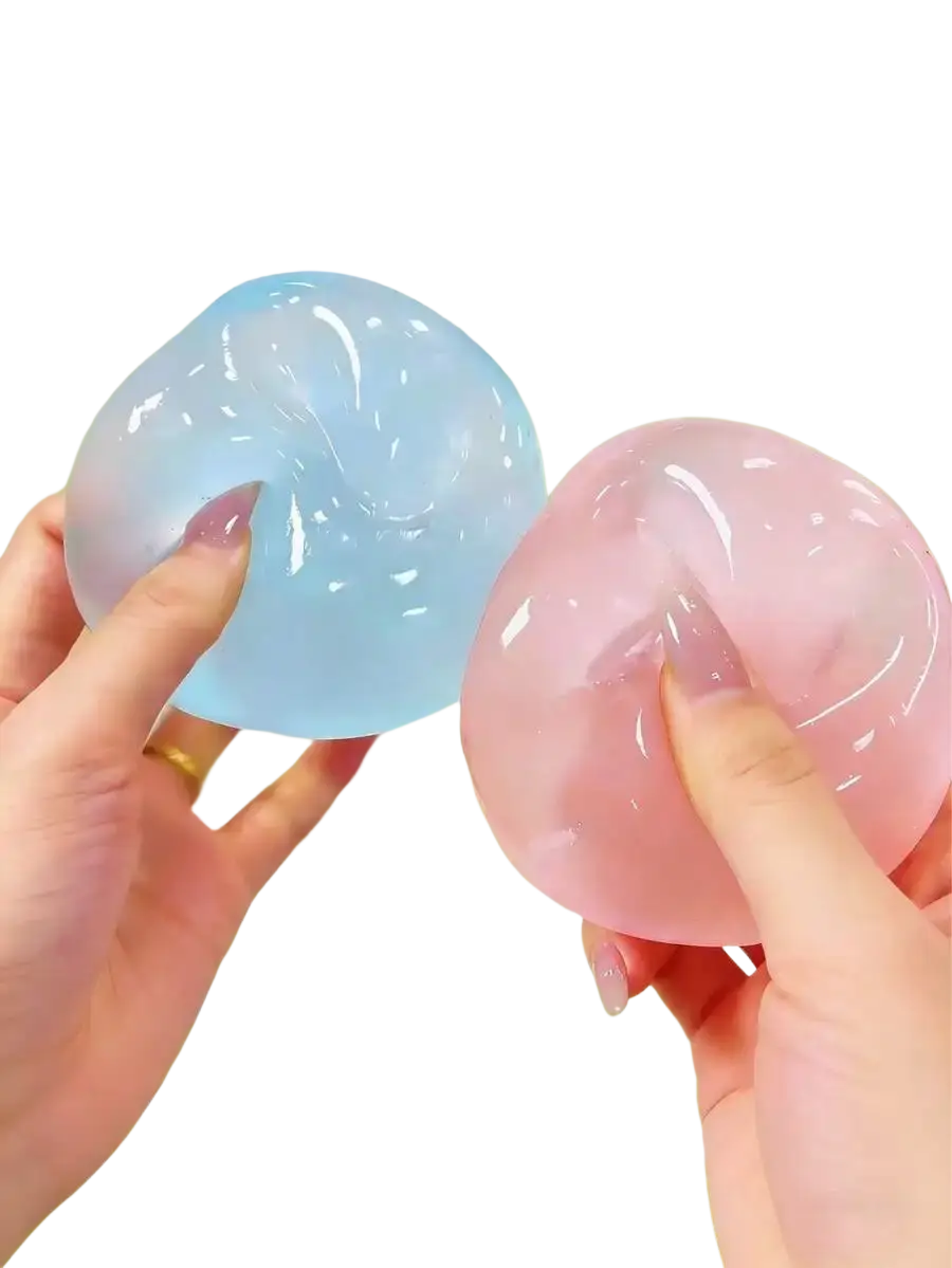Two translucent gel-like stress balls in light blue and soft pink being squeezed for stress relief use