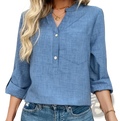Blue denim button-up blouse with v-neck, rolled sleeves, and chest pockets made of durable denim fabric