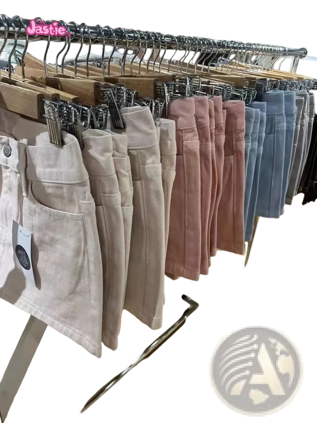 A row of pastel blue denim mini skirts high waist y2k streetwear hanging on wooden hangers with visible stitching details