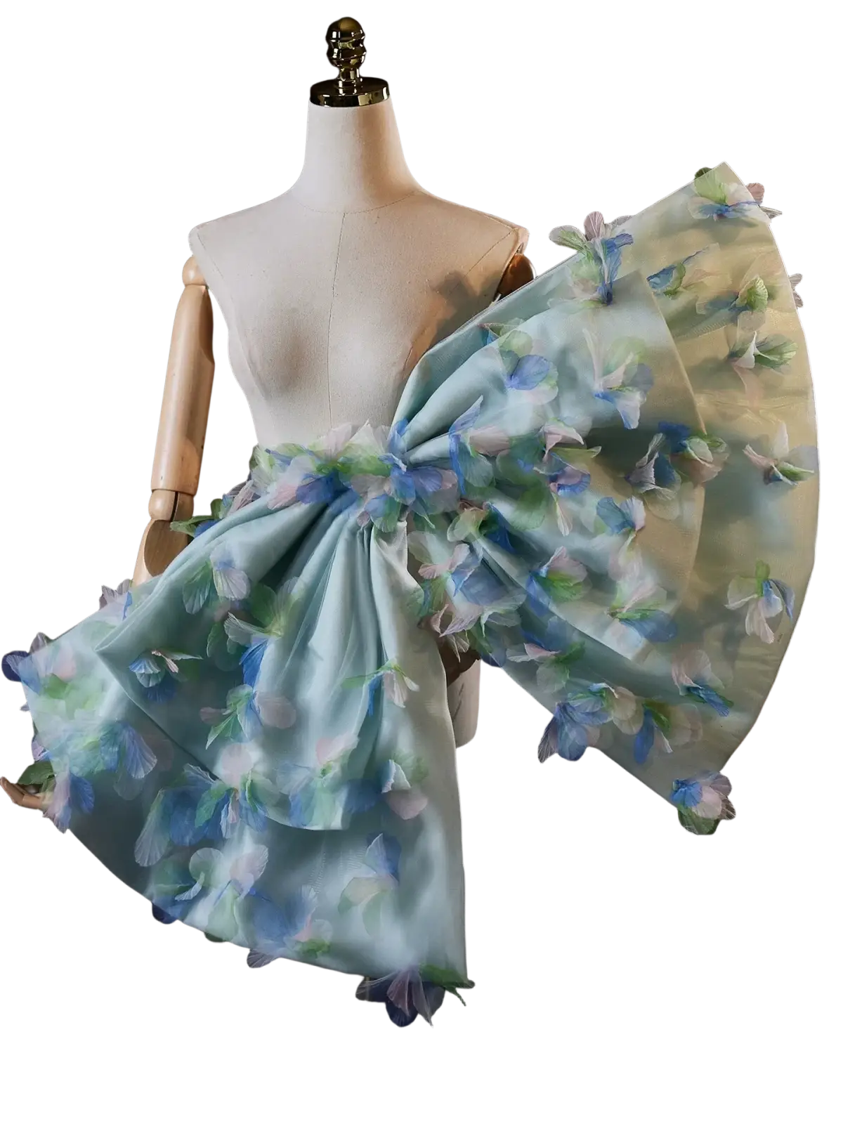 A delicate light blue floral bridal bow evening party accessory with sheer layered fabric and three-dimensional flower appliqués