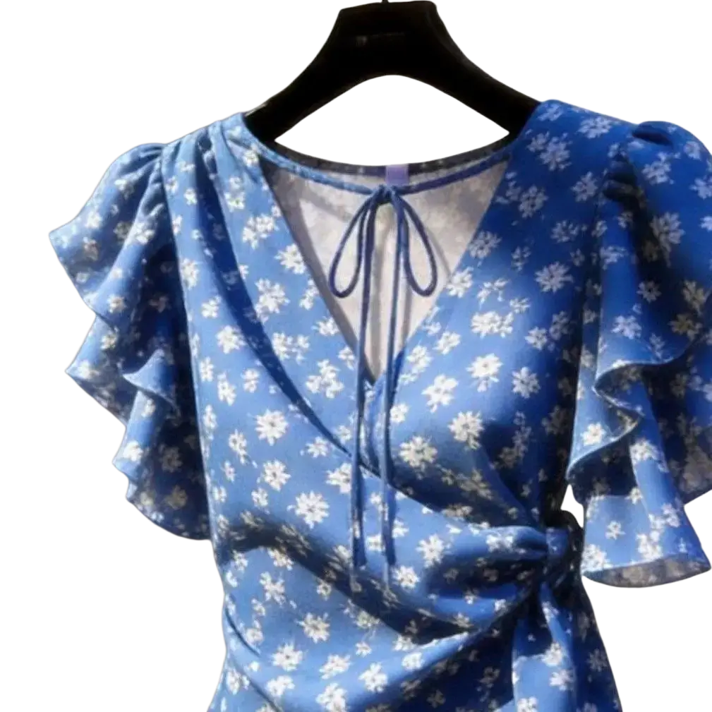 A blue floral chiffon wrap blouse with ruffled puff sleeves and a tie-front neckline