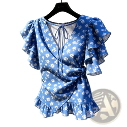 Blue floral chiffon wrap blouse with ruffled sleeves and hem featuring a delicate white flower pattern on smooth fabric