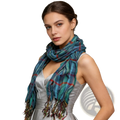 Blue jacquard textured winter scarf with multi-colored plaid pattern in teal blue and red with fringed ends