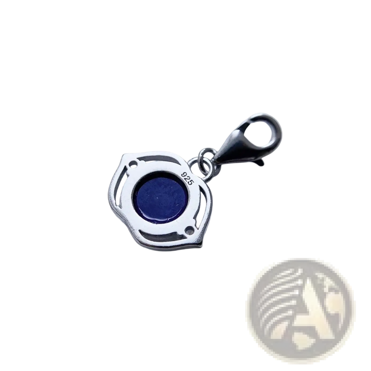 Blue lotus sterling silver charm pendant with deep blue lapis lazuli stone in ornate shield-shaped silver frame