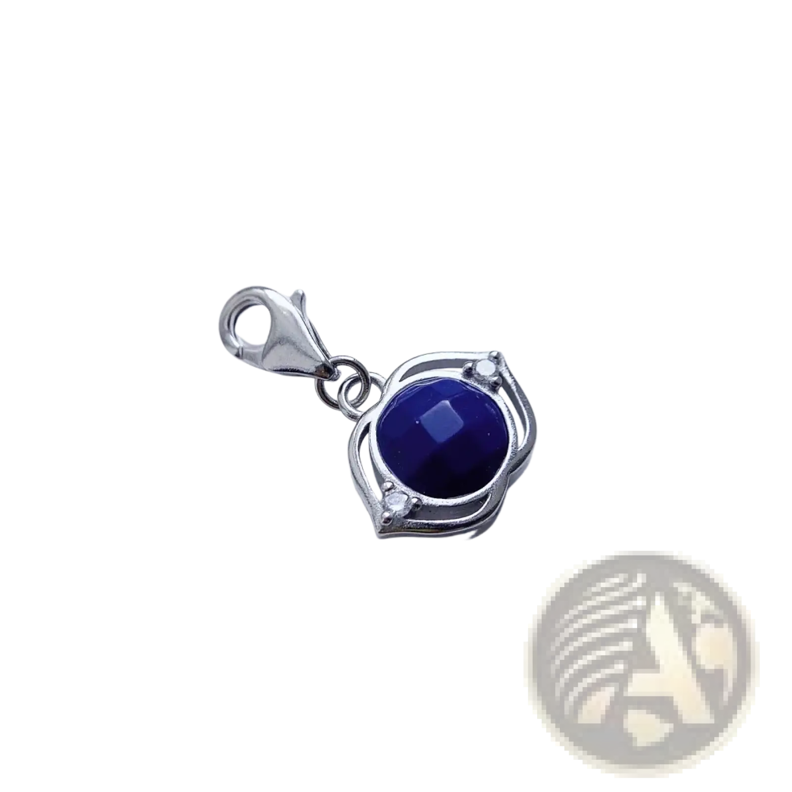 Blue Lotus sterling silver charm pendant with a deep blue faceted gemstone and ornate leaf-like frame accents
