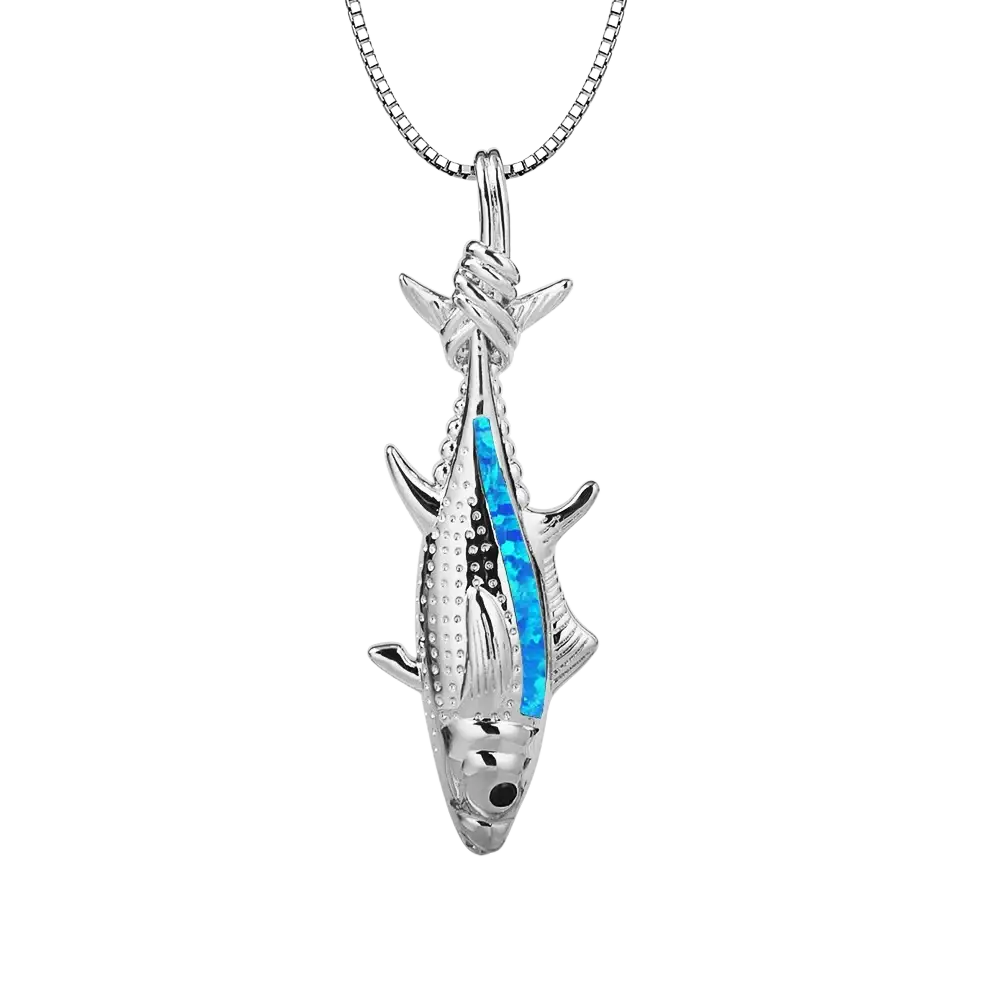Silver fish pendant necklace featuring vibrant blue opal inlay with textured scales and fins in ocean jewelry design