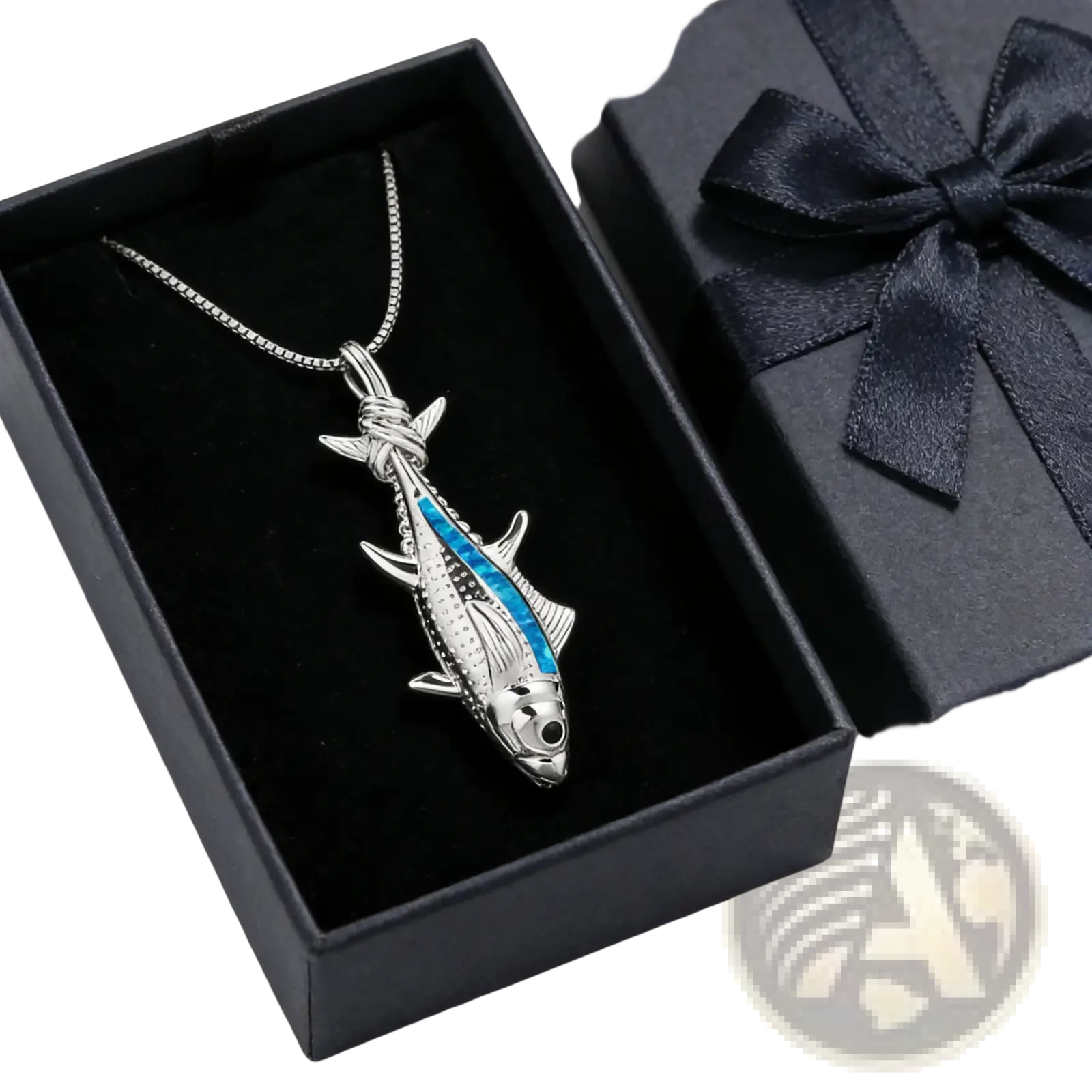 Silver fish pendant necklace with blue inlaid stripe and detailed scales displayed in an open black gift box