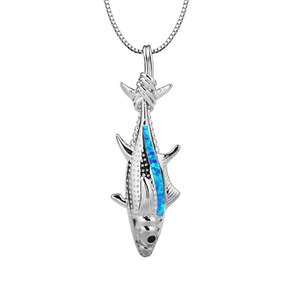 Silver fish-shaped pendant necklace with vibrant blue opal inlay on a matching silver chain ocean jewelry design