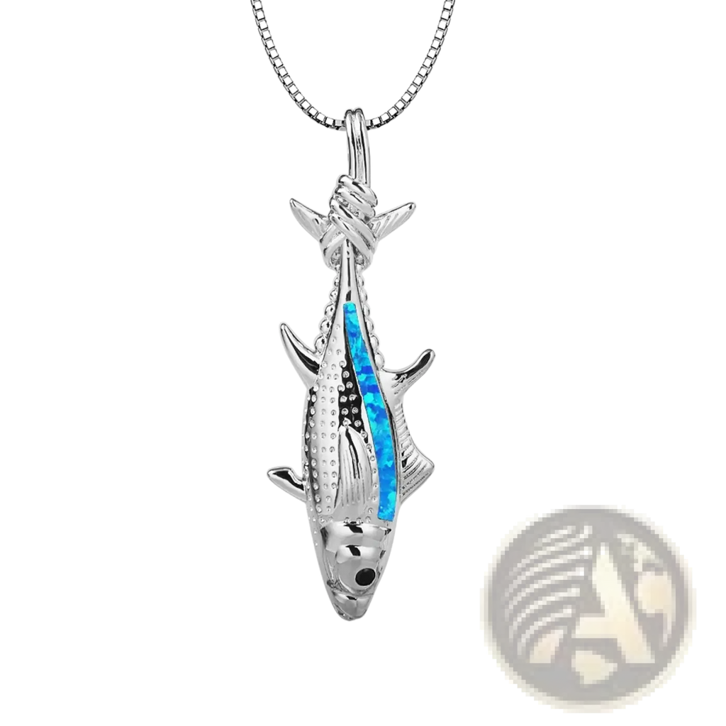 Silver fish pendant necklace featuring vibrant blue opal inlay with textured scales and fins in ocean jewelry design