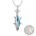 Silver fish pendant necklace featuring vibrant blue opal inlay with textured scales and fins in ocean jewelry design
