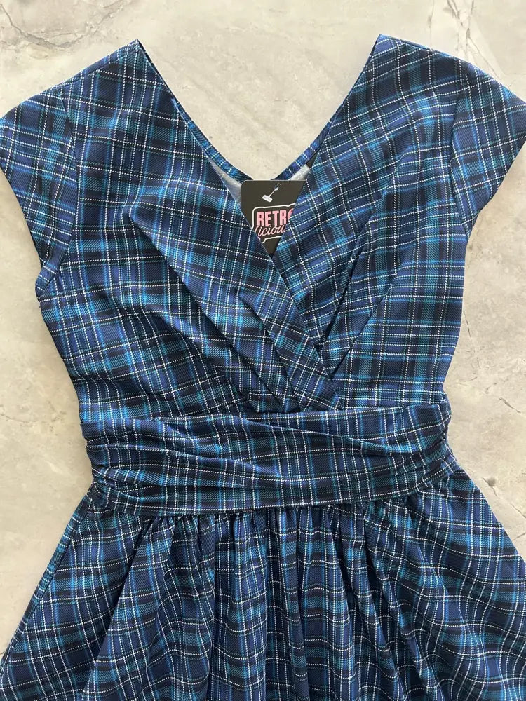 Blue plaid cotton dress with v neckline ruched waistband and pockets ideal for casual wear