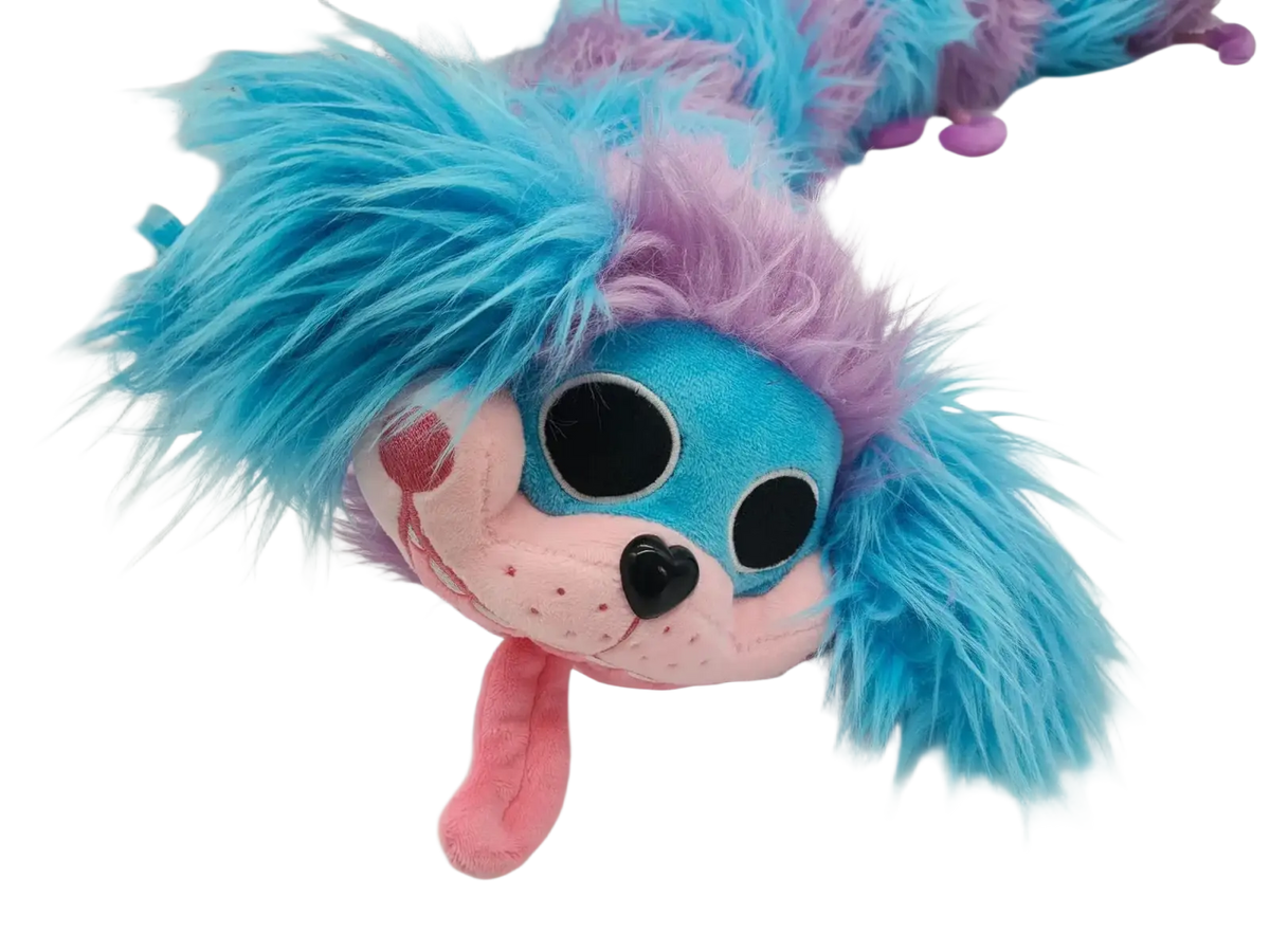 Blue and purple caterpillar plush toy with vibrant fur, pink cheeks and nose, black heart-shaped eyes, and playful expression