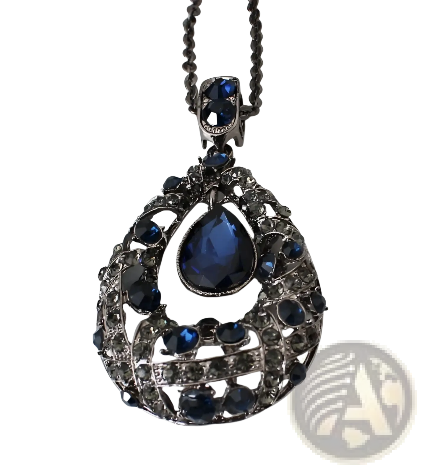 An ornate dark silver korean style sweater chain pendant with a teardrop blue gemstone and intricate filigree design