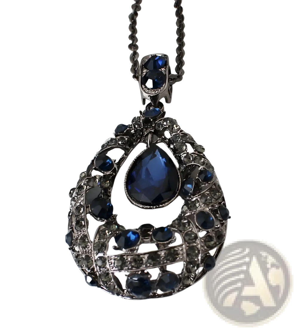 An ornate dark silver pendant necklace with a blue teardrop gemstone and filigree design in Korean style sweater chain