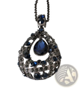 An ornate dark silver pendant necklace with a blue teardrop gemstone and filigree design in Korean style sweater chain