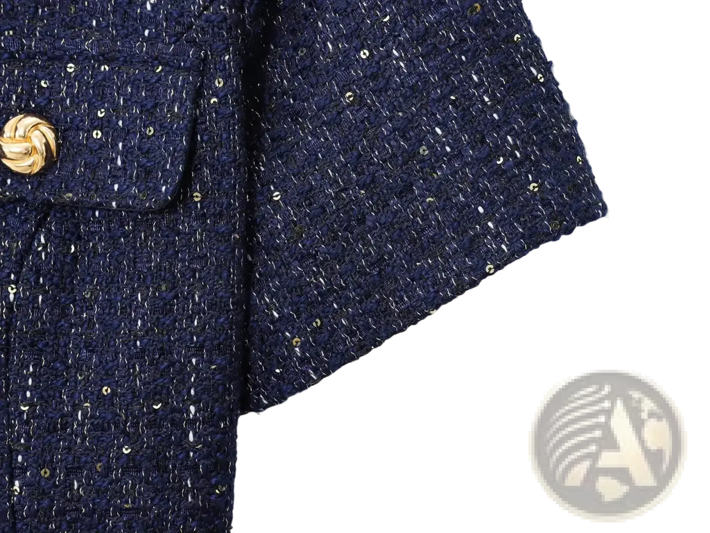Blue tweed short sleeve blazer with belt featuring dark blue tweed fabric gold sequin accents and twisted gold button