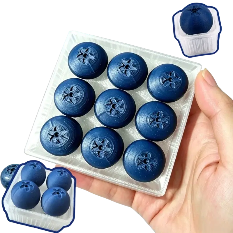 Deep blue berry-shaped fidget toy keyboard keys with textured surface and star-like indentations for stress relief
