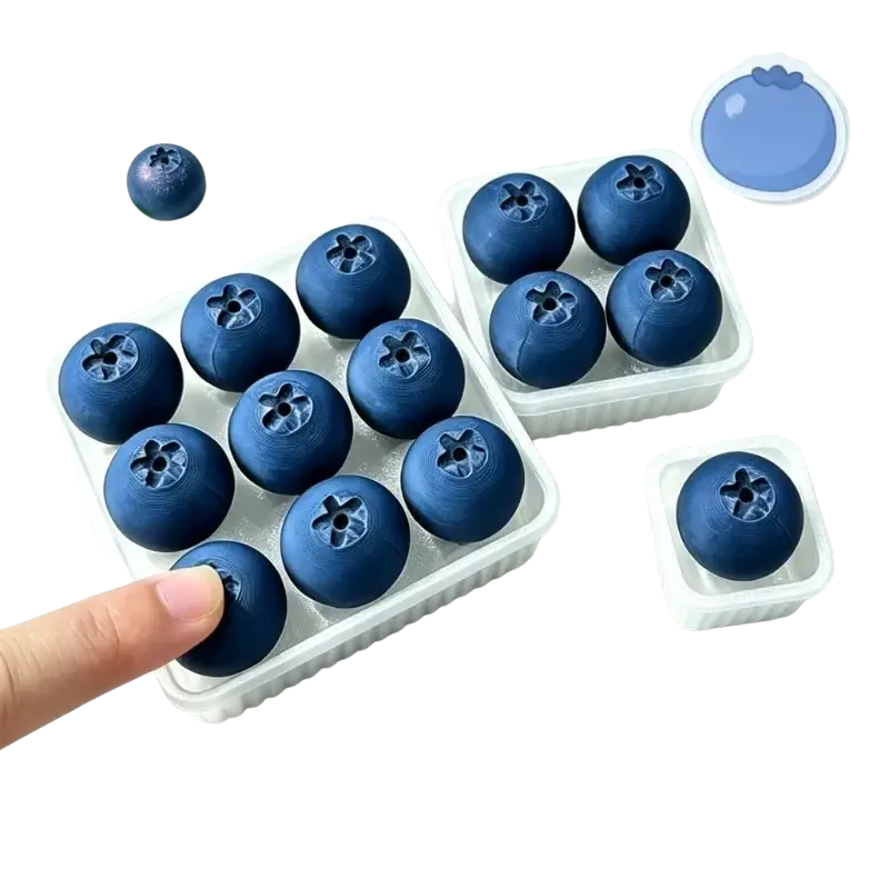 Deep blue round silicone blueberry fidget toy ice cubes in white trays for stress relief and sensory play