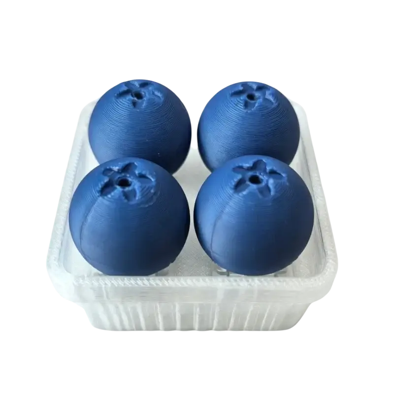 Four deep blue spherical 3d printed blueberry fidget toys with textured tops in a clear container for stress relief