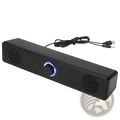 Black rectangular bluetooth computer speaker wireless desktop soundbar with blue illuminated volume knob and textured surface