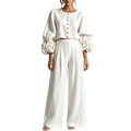 White linen crop top with puff sleeves and floral embellishments at cuffs, paired with blush pink wide leg linen pants closure type unseen