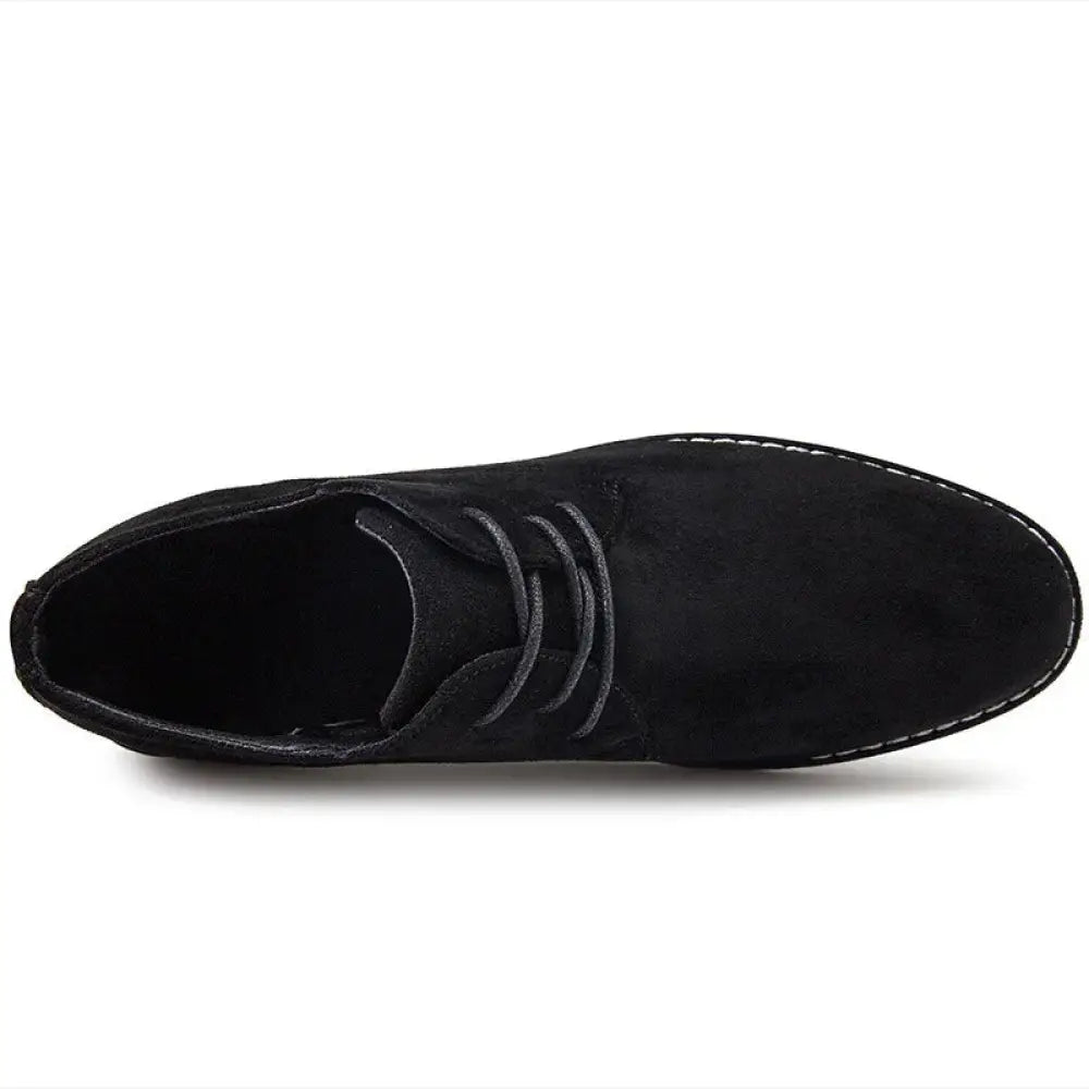 Men’s British style black suede leather chukka boot with matching laces and white stitching along the sole
