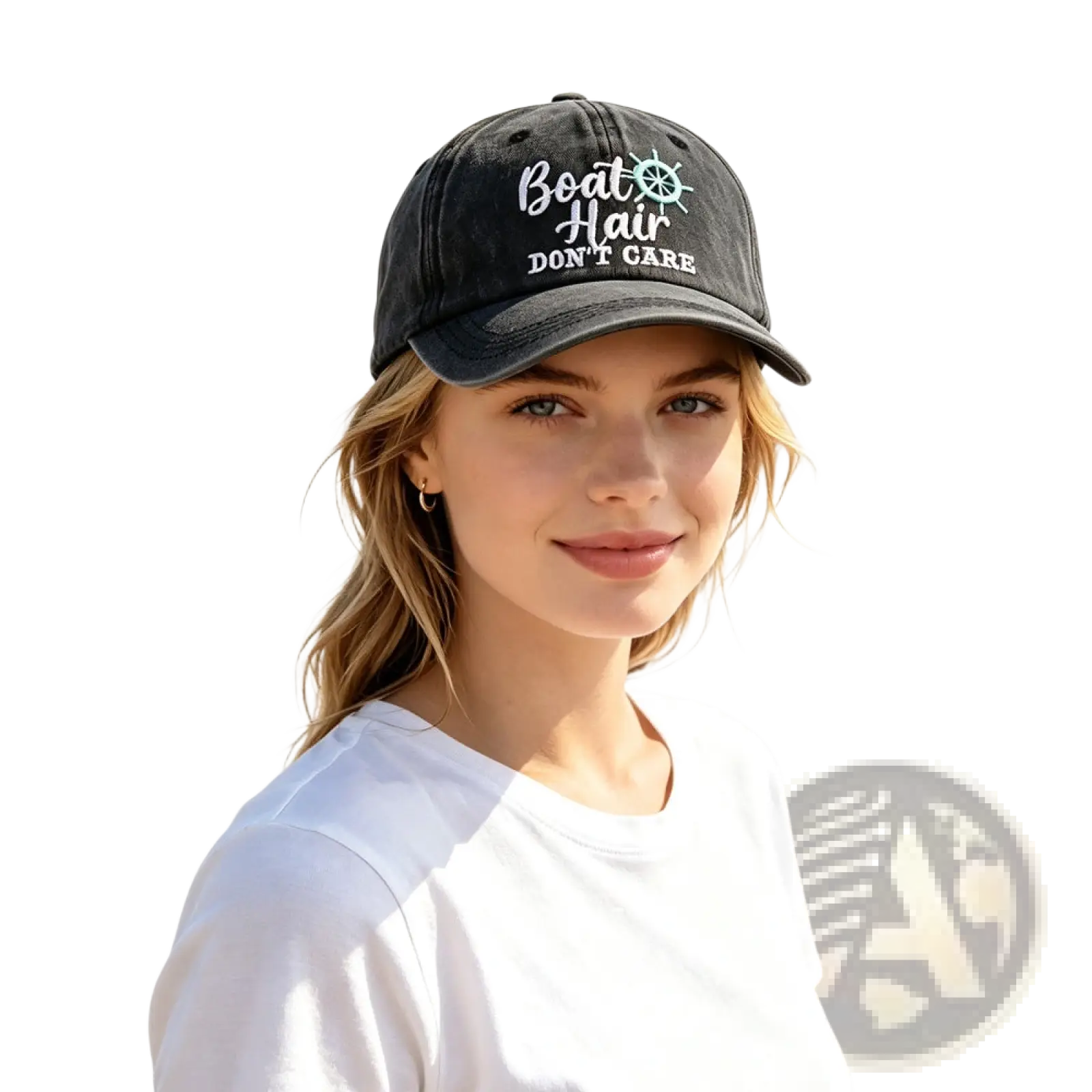 Black baseball cap with white and teal embroidered boat hair don’t care text and ship’s wheel design