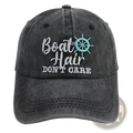 Boat Hair Don’t Care embroidered dark gray distressed cotton baseball cap with white text and light blue ship wheel graphic
