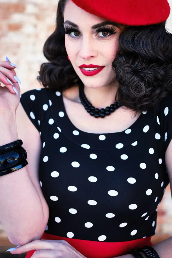 Vintage polka dot boat neck cap sleeve top in black and white with scoop neckline and lightweight fabric
